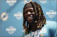  ?? TIM IRELAND — THE ASSOCIATED PRESS FILE ?? In this Sept. 29 photo, Miami Dolphins running back Jay Ajayi laughs during a press conference after a training session at Allianz Park in London. The NFL-leading Eagles have bolstered their offense by acquiring running back Jay Ajayi from the Miami...