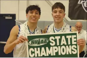  ?? CHRISTOPHE­R HURLEY — LOWELL SUN ?? Pelham seniors Dom Herrling, left, and Zach James celebrate after winning the NHIAA Div. 2state title.