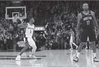  ?? AP Photo ?? HARD EARNED. San Antonio Spurs guard Lonnie Walker IV (1) reacts after scoring to tie the score in the final seconds of the second half of an NBA basketball game against the Houston Rockets in San Antonio. San Antonio won 135-133 in double overtime.