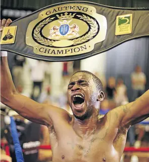  ?? /NICK LOURENS ?? Jeff Magagane proudly poses with his Gauteng lightweigh­t provincial belt. He’s in action again tonight.