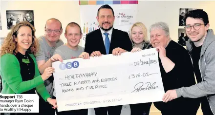  ??  ?? Support TSB manager Ryan Dolan hands over a cheque to Healthy ‘n’ Happy