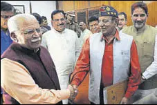  ?? KESHAV SINGH/HT ?? Chief minister Manohar Lal Khattar greets BJP’S Rajya Sabha nominee DP Vats after the latter filed his nomination at the Haryana Vidhan Sabha in Chandigarh on Monday.