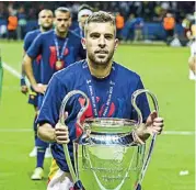  ?? ?? Jordi Alba celebrates with the Champions League trophy in 2015