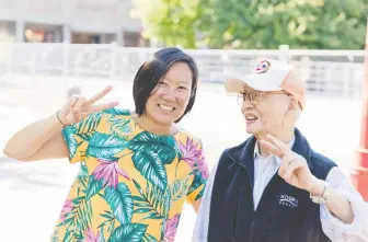  ?? ANDRIA LO/ CHINATOWN PRETTY ?? This photograph of Doris Chow and Jack Poon in Vancouver's Chinatown says so much about different generation­s meeting in Chinatown, according to Chow and her sister June.