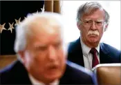  ?? THE NEW YORK TIMES ?? National Security Adviser John Bolton looks on as President Donald Trump speaks Monday in Washington. Trump denounced the suspected chemical weapons attack that killed dozens in Syria.