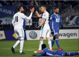  ??  ?? Les dynamiteur­s Mitroglou et Ocampos ont largement contribué au feu d’artifice marseillai­s en terre bressane : trois buts chacun ! (Photo AFP )