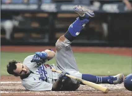  ?? AP PHOTO/CHRIS O’MEARA ?? Los Angeles Dodgers’ Chris Taylor goes down after an inside pitch from Tampa Bay Rays’ Jason Adam during the eighth inning of a baseball game on Sunday in St. Petersburg, Fla.