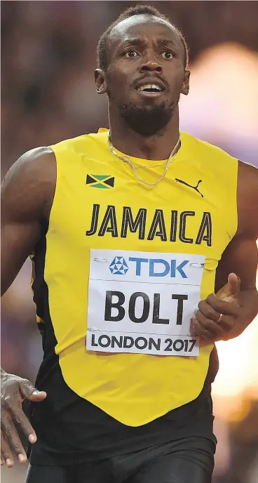  ?? BEN STANSALL / AFP / GETTY IMAGES ?? Jamaica’s Usain Bolt runs to third place in the final of the men’s 100-metres at the 2017 IAAF World Championsh­ips at London Stadium on Saturday.