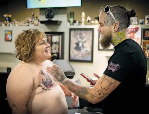  ??  ?? COSMETIC POST-SURGERY: P.ink (Personal Ink) is a nonprofit collective that matches breast cancer survivors with tattoo artists who have experience with mastectomy tattoos.