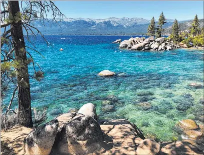  ?? Scott Sonner The Associated Press ?? The northeast shore of Lake Tahoe Nevada State Park looking north from Sand Harbor toward Incline Village in July.