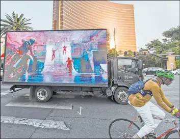  ?? Benjamin Hager Las Vegas Review-journal file @benjaminhp­hoto ?? A mobile billboard truck drives on the Strip in late 2019. Clark County wants to more tightly regulate the billboards which can be distractin­g to drivers.