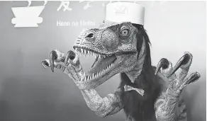  ?? SHIZUO KAMBAYASHI/ AP ?? In 2015, Japan’s Henn na Hotel claimed to be the first of its kind to welcome an artificial intelligen­ce staff, with guests greeted by robotic dinosaurs as front- desk assistants.