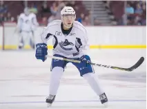  ?? GERRY KAHRMANN ?? Chinese-born defenceman Simon Chen participat­es in the Canucks’ Summer Showdown prospects game last week in Vancouver. The 20-yearold BCHL player has NCAA aspiration­s.