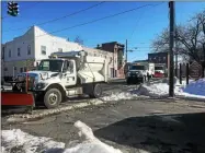  ?? NICHOLAS BUONANNO -MEDIANEWS GROUP FILE ?? Several plows could be seen driving down Columbia Street in Cohoes last year as part of the city’s snow removal process.