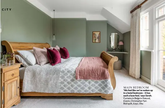 ??  ?? MAIN BEDROOM ‘We feel like we’ve woken up in a hotel bedroom – it has such a luxe feel,’ says Sarah. Curtains in Belge in Natural, £130m, Christophe­r Farr. Bed quilt, £250, Oka