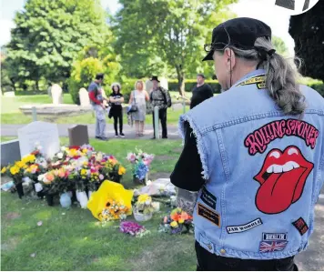  ?? Pictures: Mikal Ludlow Photograph­y ?? Christian Niederhube­r, above, travels every year from Austria to pay his respects to former Rolling Stone Brian Jones; below, many more joined him at Jones’s graveside last week