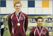  ?? THOMAS NASH — DIGITAL FIRST MEDIA ?? Conestoga’s Brendan Burns, center, and Brian McKenrick won gold and bronze, respective­ly, in the 100 backstroke at the PIAA Class 3A Swimming Championsh­ips at Bucknell University Sunday.