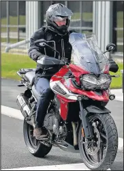  ??  ?? The Duke of Cambridge tries out a Triumph Tiger 1200 XRT motorcycle during a visit to Triumph