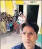  ??  ?? A teacher takes a selfie at a school in Varanasi on Monday to mark his attendance.