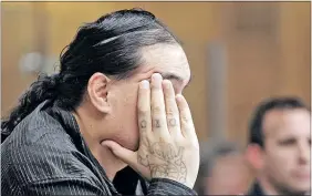  ??  ?? DENIES ALLCHARGES: Steven Rakuraku hides his face in court.