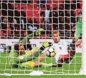  ?? EPA PIC ?? England’s Harry Kane scores against Slovenia in their World Cup qualifying Group F match at Wembley on Thursday.