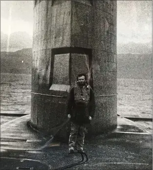  ??  ?? ON DECK: Peter aboard Polaris submarine HMS Repulse, with the Isle of Skye behind