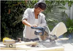  ??  ?? A mitre saw is one of the most helpful tools for the home workshop, especially if it slides to accommodat­e larger pieces of wood.