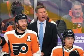  ?? AP PHOTO ?? Philadelph­ia Flyers coach Dave Hakstol yells to his team during Tuesday’s home game against the Ottawa Senators.