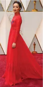  ??  ?? Noel West / New York Times Ruth Negga ruled the Oscars red carpet wearing a custom Valentino gown with a long flowing skirt, high neck and long sleeves.