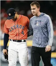  ??  ?? Astros manager A.J. Hinch said outfielder George Springer, left, is dealing with a left hamstring injury and a stint on the injured list is possible.