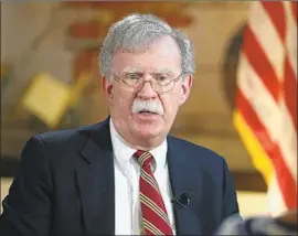  ?? Emily Michot Miami Herald ?? NATIONAL security advisor John Bolton announced the sanctions in Miami days before two hotly contested elections in Florida, where many Venezuelan exiles live.