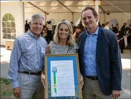  ?? OFFICE OF ASSEMBLYMA­N JAMES GALLAGHER — CONTRIBUTE­D ?? Left to right, Jesus Center board chair Larry Ruby, Executive Director Amber Abney-Bass and Assemblyma­n James Gallagher pose for a picture Wednesday with a resolution recognizin­g the Jesus Center as a 2022 nonprofit of the year in Sacramento.