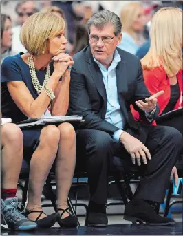  ?? JESSICA HILL/AP PHOTO ?? UConn head coach Geno Auriemma, right, talks with associate head coach Chris Dailey in a game against South Florida on Jan. 10 at the XL Center in Hartford.