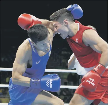  ??  ?? Josh Kelly in action against Kazakhstan’s Daniyar Yeleussino­v at the Olympics