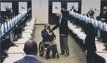  ?? PATRICK SEMANSKY/ AP ?? Texas Gov. Greg Abbott, hosting President Joe Biden on Feb. 26 for a tour of the Harris County Emergency Operations Center in Houston, announced this week that he would lift his state’s mask mandate.