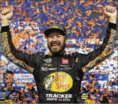  ?? STEVE HELBER/ASSOCIATED PRESS ?? Martin Truex Jr. celebrates winning in Richmond, Va., in September. Truex is in third place in the NASCAR playoff standings heading into today’s race at Fort Worth, Texas.