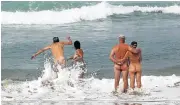  ?? Picture: ALON SKUY ?? NUDE AWAKENING: Naturists test the waters at Trafalgar Beach on the KwaZulu-Natal coast