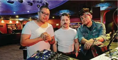  ?? Ted S. Warren / Associated Press ?? The American band ARIZONA — David Labuguen, from left, Zachary Charles and Nate Esquite — are among several groups that contribute­d tracks to “TIM,” which was released last week.