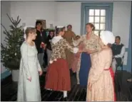  ??  ?? Colonial dancers will be featured at the Candleligh­t Holiday Reception at the Beidler House in Gibraltar.