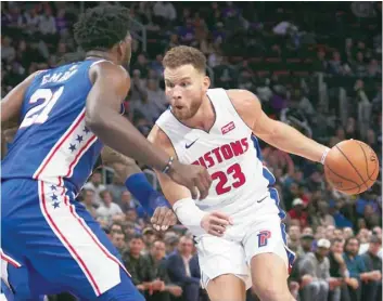  ?? — USA Today Sports ?? Detroit Pistons’ forward Blake Griffin (23) dribbles on Philadelph­ia 76ers centre Joel Embiid (21) in the second half at Little Caesars Arena.