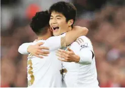  ??  ?? WALES: Swansea City’s Ki Sung-yueng celebrates scoring the opening goal against West Bromwich Albion during the English Premier League soccer match at the Liberty Stadium, Swansea, Wales, yesterday. — AP