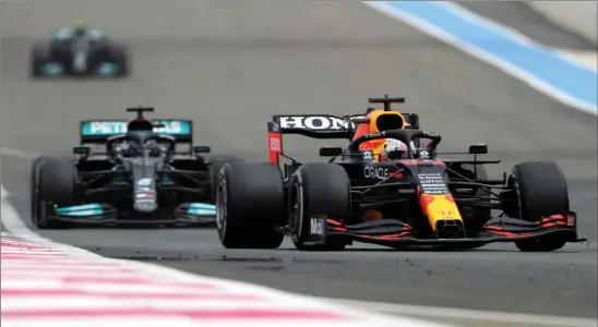  ??  ?? Max Verstappen in his Red Bull leads Lewis Hamilton’s Mercedes on his way to victory at the French Grand Prix