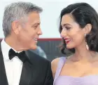  ??  ?? George Clooney, left, and his wife Amal Clooney pose for photograph­ers upon arrival at the premiere of the film Suburbicon during the 74th edition of the Venice Film Festival in Venice, Italy