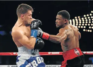  ?? Picture: GETTY IMAGES/AFP AL BELLO ?? PUNCHING POWER: Daniel Jacobs, right, punches Sergiy Derevyanch­enko during their IBF middleweig­ht title fight at Madison Square Garden in New York on Saturday.