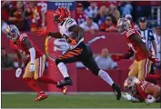  ?? JOSE CARLOS FAJARDO — STAFF PHOTOGRAPH­ER ?? The 49ers' Nick Bosa, bottom right, fails to tackle Bengals running back Joe Mixon during Sunday's loss.