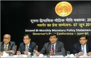  ?? IANS ?? RBI Governor Raghuram Rajan with Deputy Governors S.S. Mundra (extreme left), H.R. Khan (second from left) and Urjit Patel (extreme right) during a press conference to announce the RBI’s second monetary policy review in Mumbai on Tuesday.