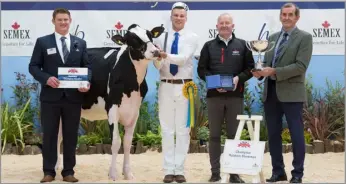  ?? ?? (centre left) with his winning calf, the judge Michael Yates left, sponsor and John Jamieson HUKI president (right)