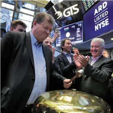  ??  ?? Ardagh Group Chairman Paul Coulson, left, is applauded as he rings a ceremonial bell on the floor of the New York Stock Exchange to mark the company’s IPO in March this year Any investment commentary in this column is from the author directly and...