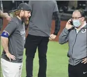  ?? JUSTIN TURNER Wally Skalij Los Angeles Times ?? did not keep a mask on during the postgame celebratio­n despite his positive test.