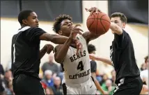  ?? CHRIS SPONAGLE — SPECIAL TO THE READING EAGLE ?? Berks Catholic’s Josiah Jordan loses control of the ball during the Saints’ loss to Archbishop Carroll.